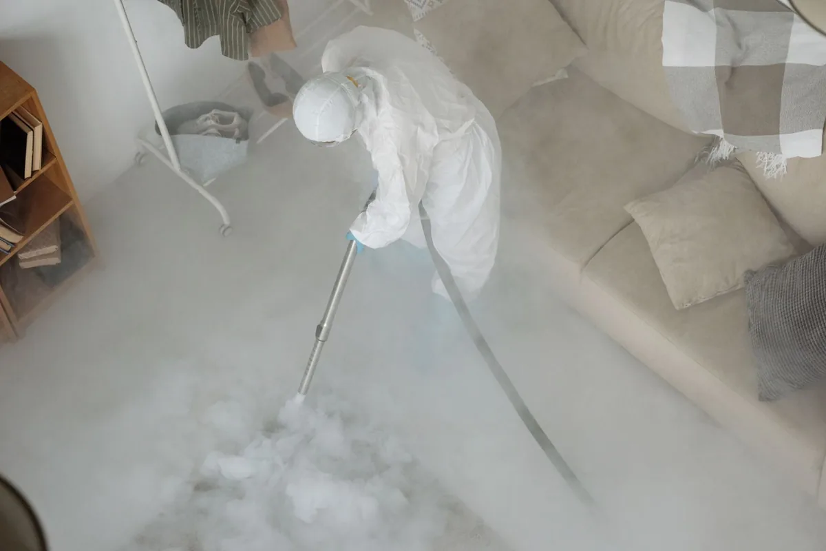 Biohazard cleanup technician in protective equipment, St. Matthews, KY